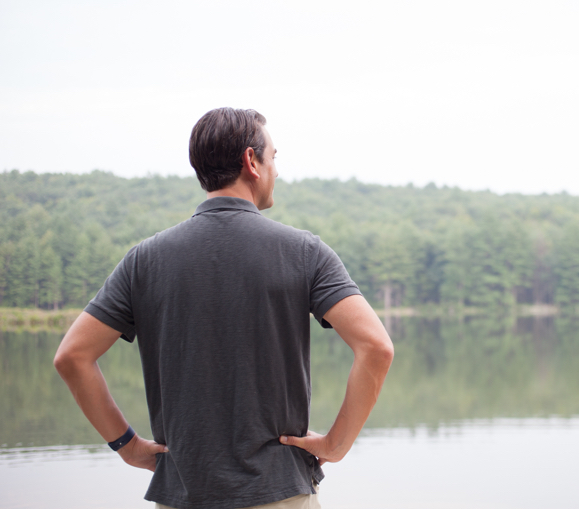 Clayton Morris looks out at a lake